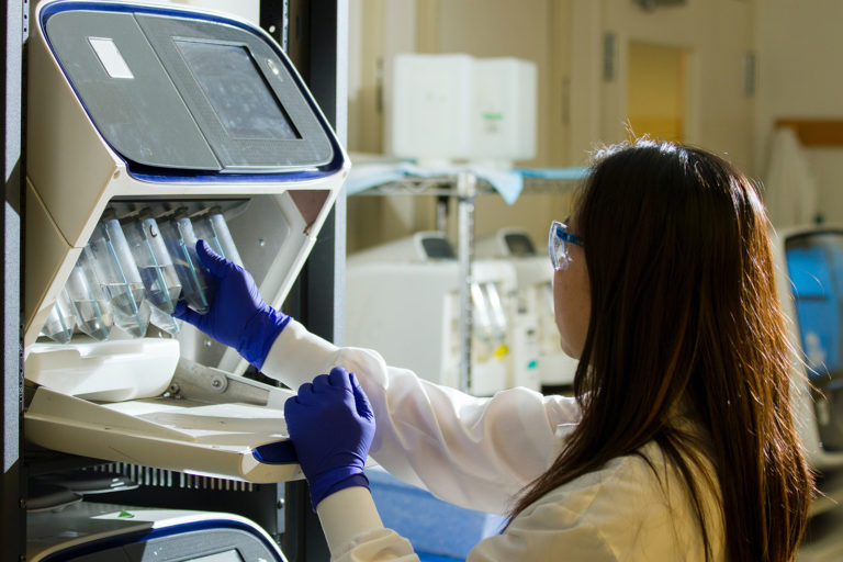 Lab technician working with test tubes