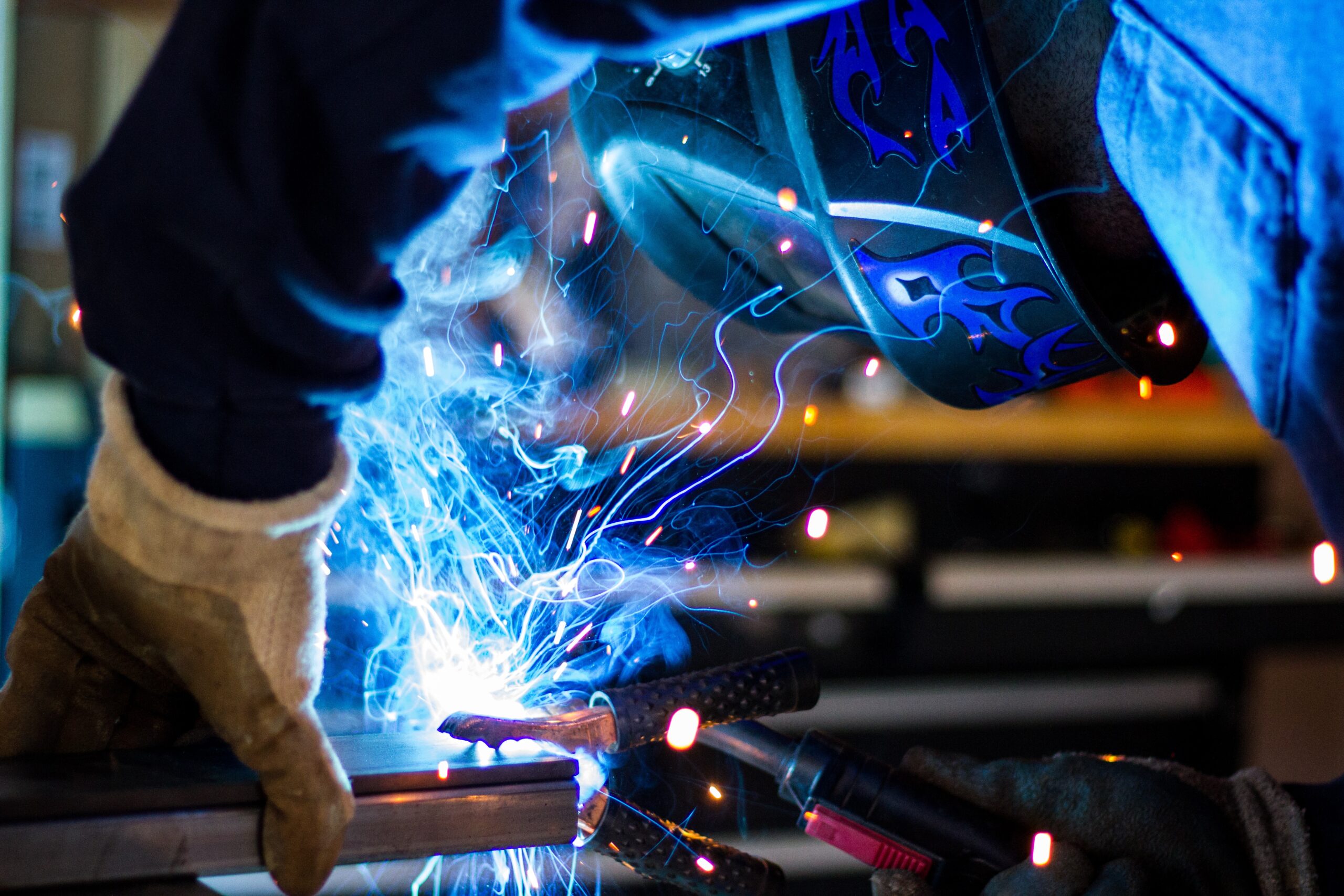 Machinist using welding equipment