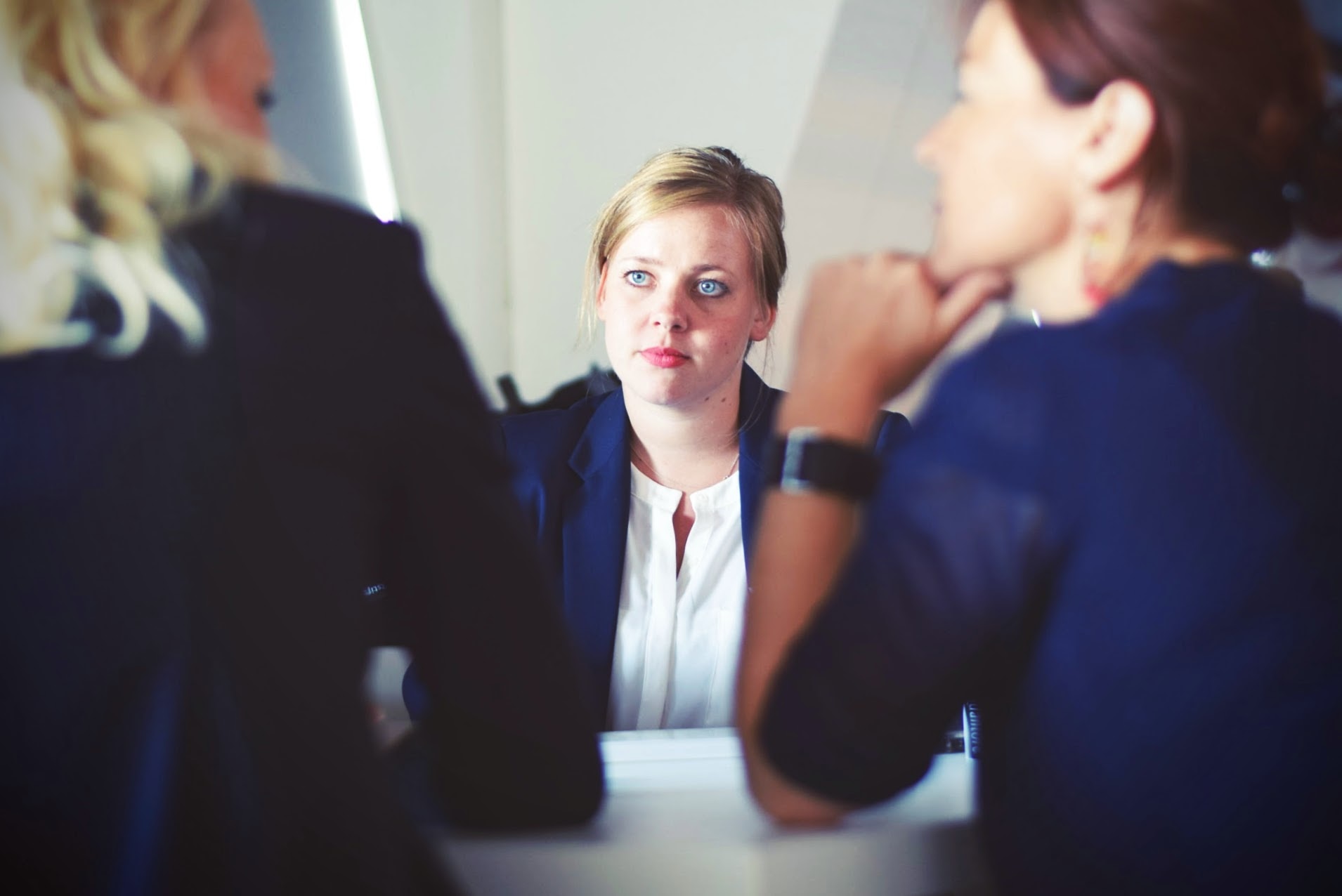 Concerned professional at a table with others